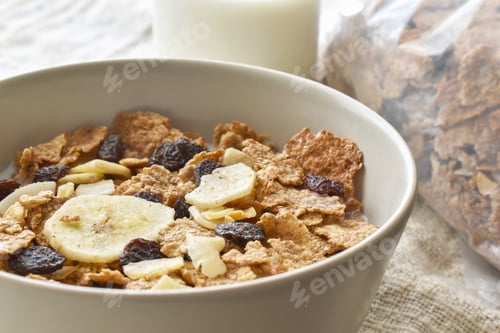 Preview: Fruit and fiber cereal with milk in a bowl.