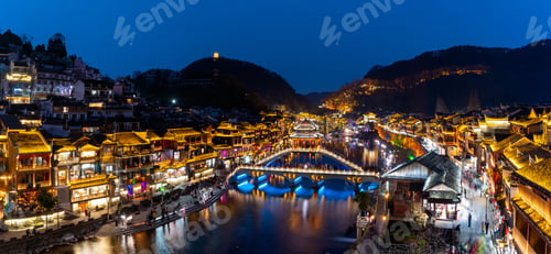 Preview: Feng Huang Ancient Town (Phoenix Ancient Town) and tourist boats on Tuo Jiang River