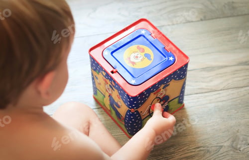 Preview: Small Boy Playing With Jack In the Box
