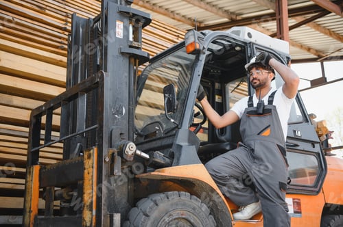 Preview: Warehouse worker driving forklift arranging lumber planks