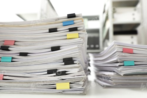 Preview: Stacks of documents with paper clips on office desk, closeup