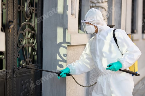Preview: Healthcare worker disinfecting contaminated city area due to coronavirus pandemic.