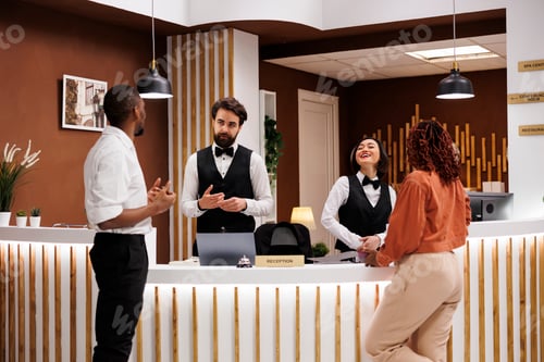 Preview: Diverse workers helping hotel guests