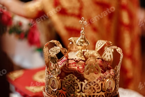Preview: gold and red crown the weddings intended for ceremony in orthodox church. selective focus.