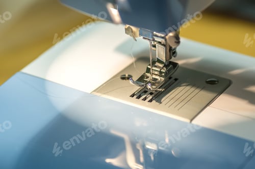 Preview: close up mechanism of sewing machine foot with needle and thread