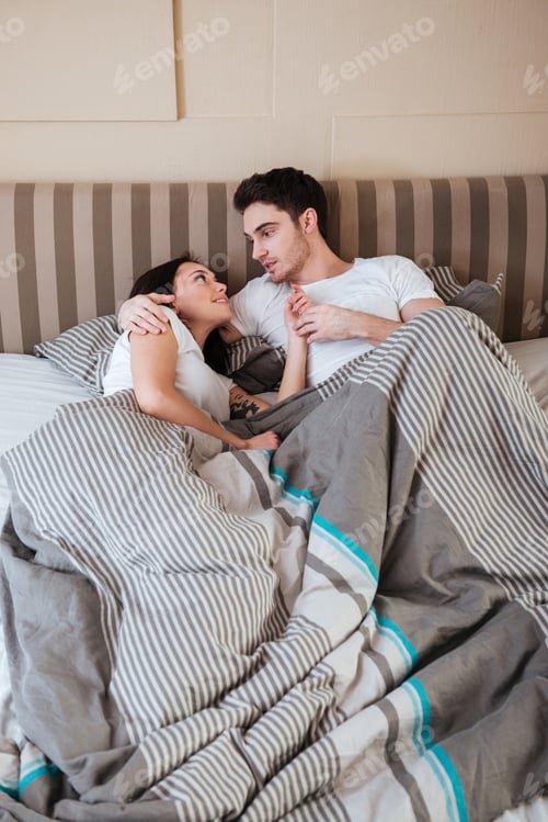 Preview: couple lying in bed