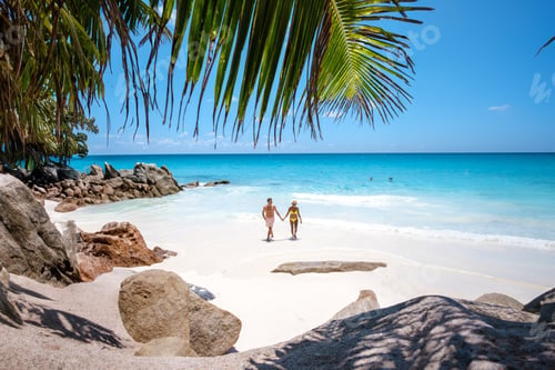 Preview: Anse Source d'Argent beach, La Digue Island, Seyshelles couple men and woman at the beach