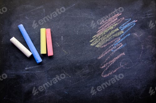 Preview: Colorful Chalk on a Smooth Black Chalkboard Surface That Invites Creativity and Fun
