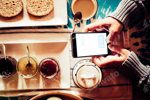 Preview: Breakfast morning and chat messages with mobile phone - people working with technology