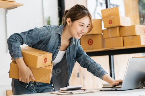 Preview: Young business start up online seller owner using computer for checking the customer orders from ema