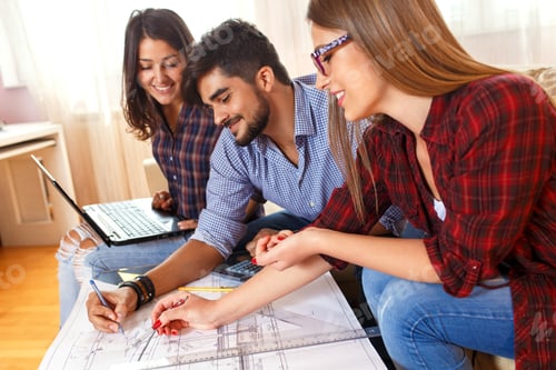 Preview: Three young students learning together at home.
