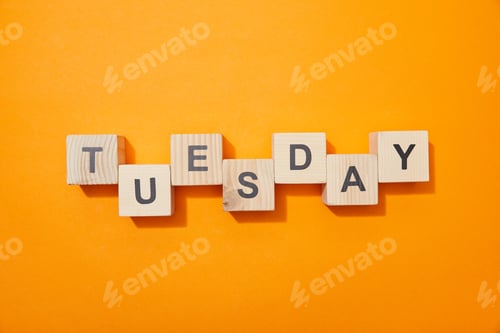 Preview: top view of wooden blocks with letters on orange surface