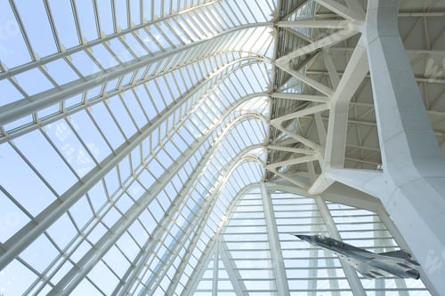 Preview: Modern architecture showcasing a sweeping glass canopy and intricate structure.