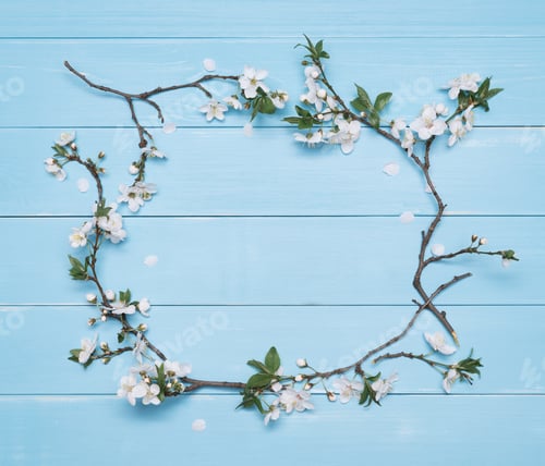 Preview: Flower frame on a blue wooden background