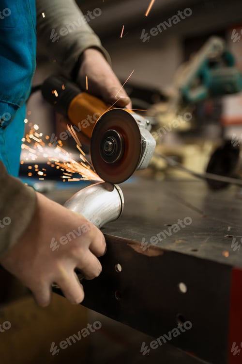 Preview: Men hands working in the garage with tools.