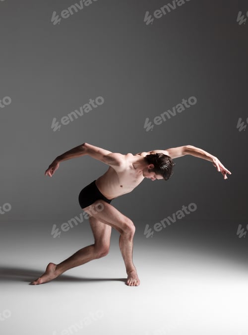 Preview: The young attractive modern ballet dancer on white background