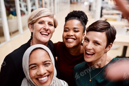 Preview: Portrait of a group of businesswomen taking selfies together in an office