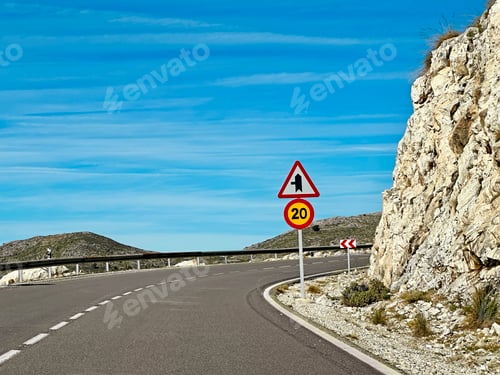 Preview: Countryside Landscape with a traffic sign Against Blue Cloudy Sky