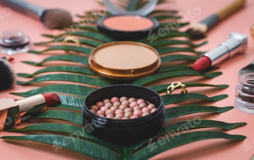 Preview: A set of female cosmetics on a pink background.