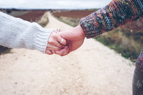 Preview: Closeup of a young couple held hands showing their engagement