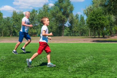 Preview: Toddler boy jogging with his father