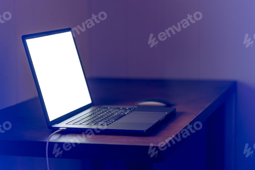 Preview: Blank screen workspace with computer laptop on table at night, copy space.