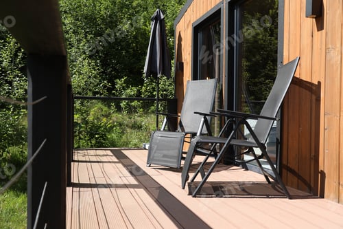 Preview: Cottage terrace with chairs on sunny day