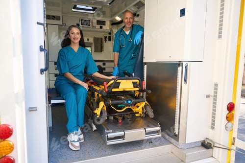 Preview: Man and woman in medical uniforms are inside an ambulance