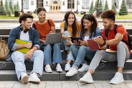 Preview: Group Of Happy Multiethnic Students Preparing For Exams Together Outdoors