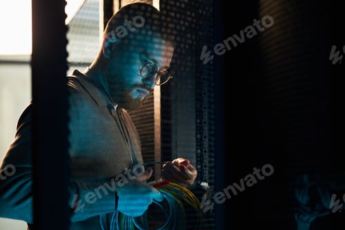 Preview: Technician Working on Server Equipment in Data Center