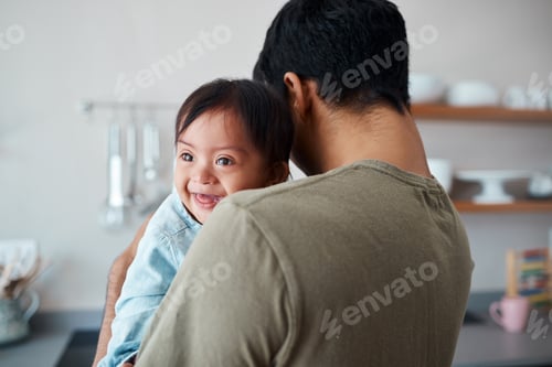 Preview: Down syndrome, baby and father bonding in a kitchen, happy and relax in their home together. Disabi