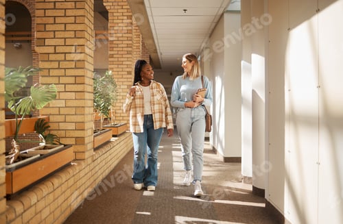Preview: University, friends and women walking, talking and education in hall, conversation and bonding. You