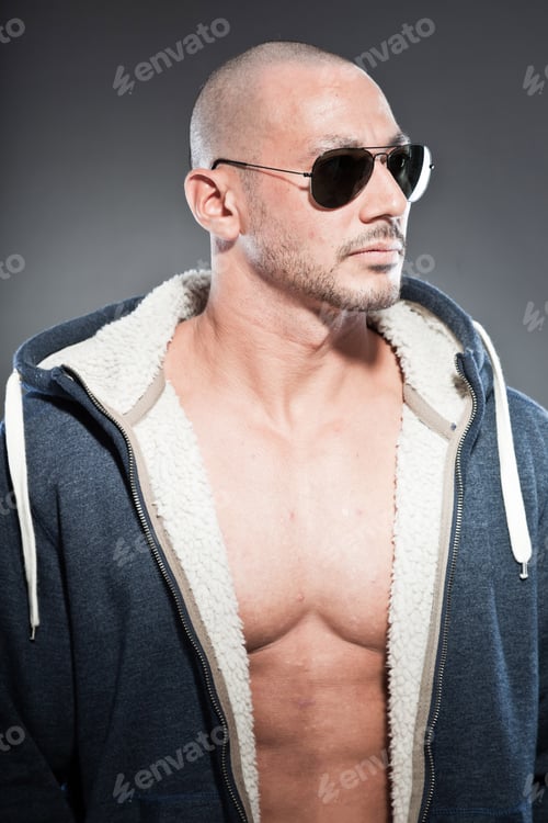 Preview: Muscled Fitness Man. Cool Looking. Tough Guy. Brown Eyes. Bald. Wearing Blue Hood Shirt And