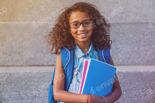 Preview: Portrait of happy african young preteen girl elementary middle