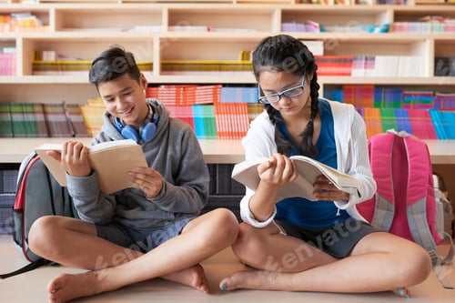 Preview: Teenagers sitting on floor reading