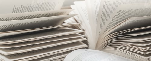 Preview: stack of books, close up. Open book on the table in library. Back to school concept.