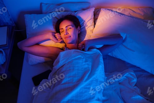 Preview: Woman Sleeping in Bed at Night