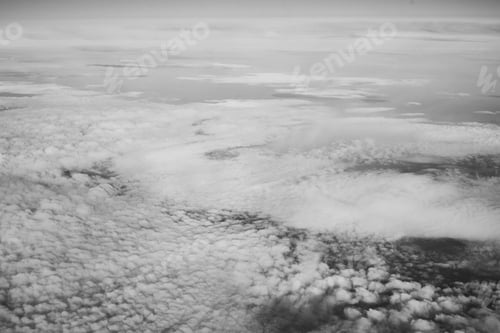 Preview: White fluffy clouds top view from the airplane window. Abstract background
