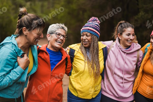Preview: Multiracial women having fun together during hiking day