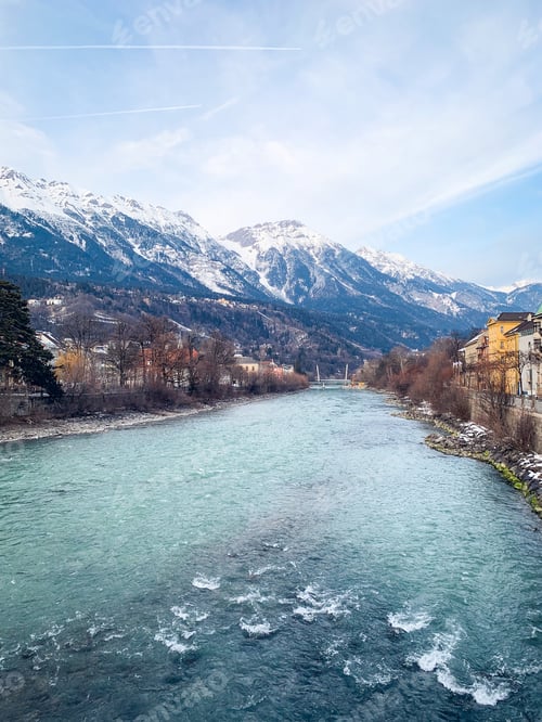 Preview: A river flows in the middle of the city. Beautiful nature. Houses are on both sides of the river