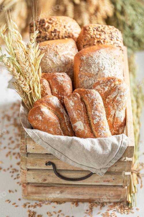 Preview: Brown rolls and buns in wooden box