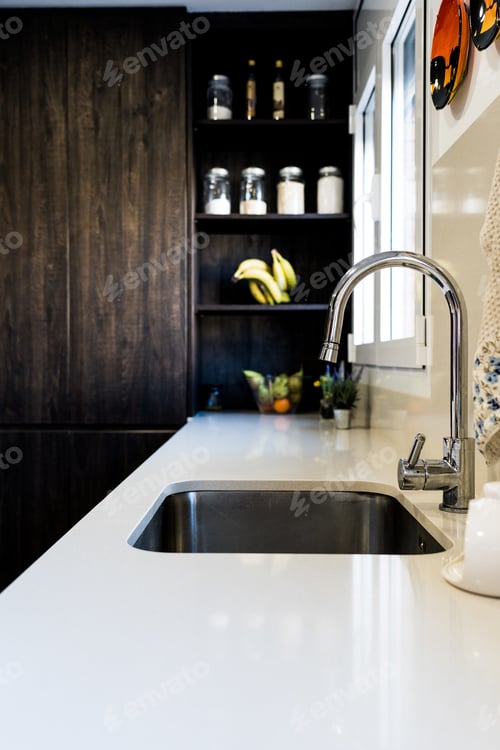 Preview: Vertical shot of a modern kitchen interior with a sink
