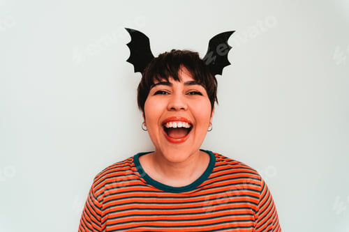 Preview: Self-portrait of a smiling caucasian female with a bat-shaped headband