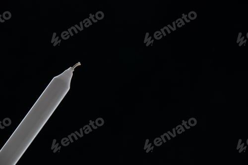 Preview: front view of white long candle on a dark surface death funeral war palestine