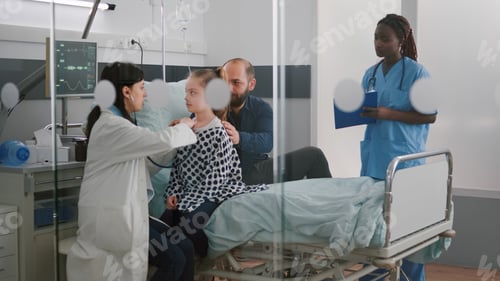 Preview: Paediatric doctor examining chest listening heartbeat using medical stethoscope