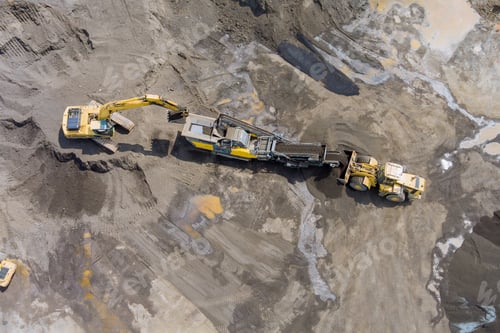 Preview: Top view of the stone crusher conveyor belt heavy excavators loading stones into the crusher
