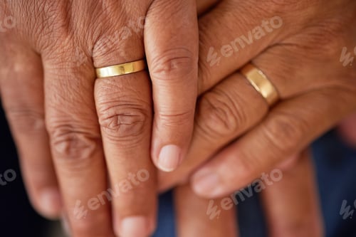 Preview: Support, trust and love of a senior married couple hands with rings and are in love for many years.