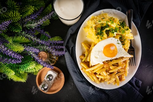 Preview: Fried eggs with boiled potatoes and yellow string beans.