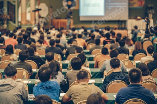 Preview: Rear view of Audience in the conference hall or seminar meeting which have Speakers