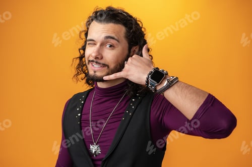 Preview: Young caucasian man with curly hair says call me back against yellow background